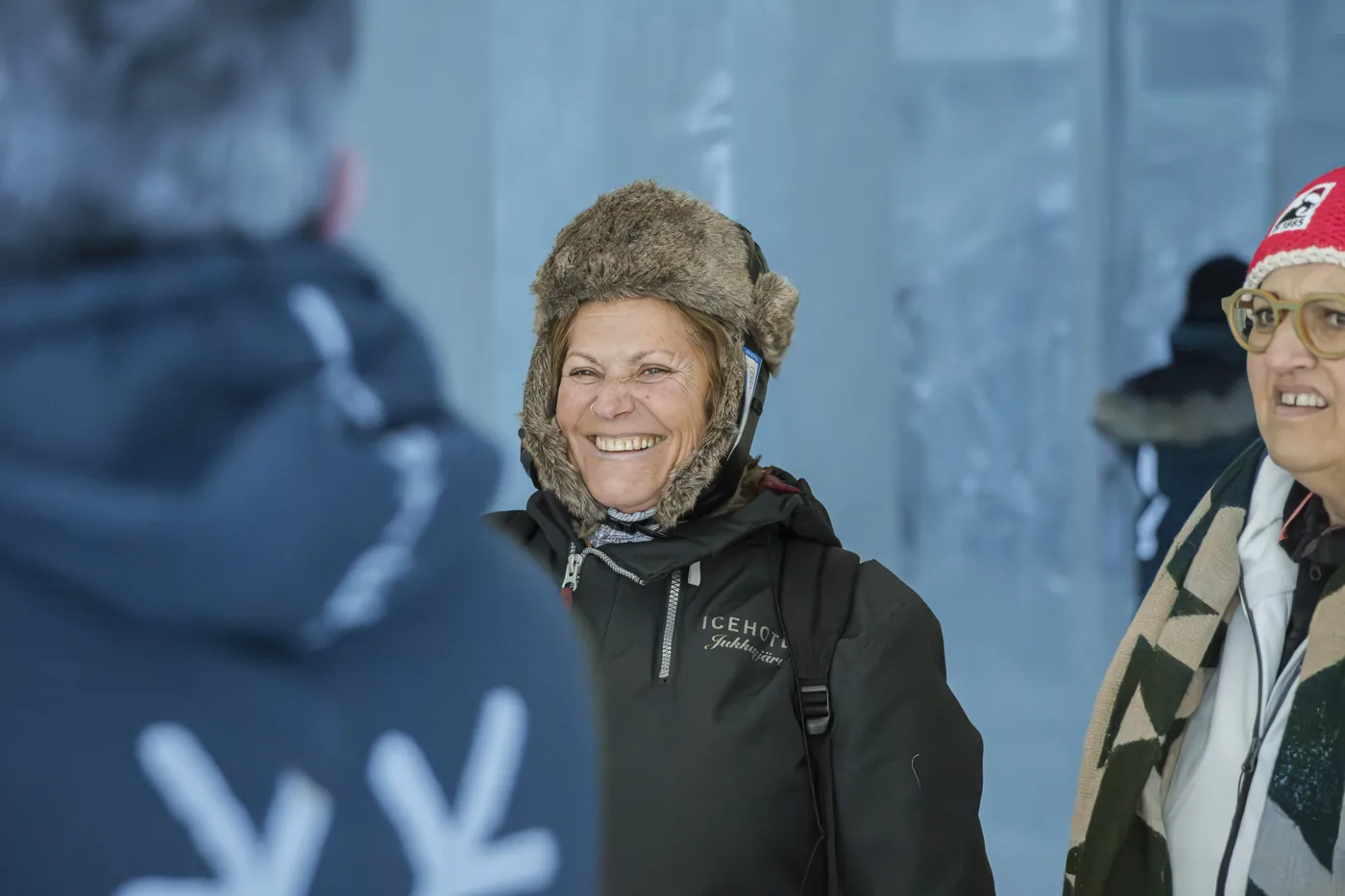 Guests smiling inside the ICEHOTEL in Jukkasjärvi
