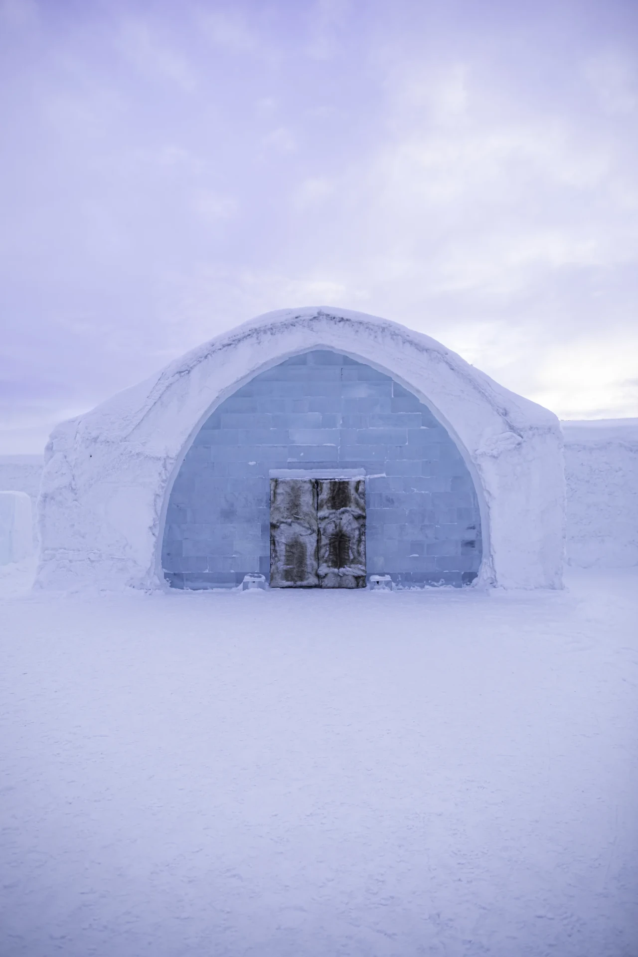 Snow-covered exterior of the ICEHOTEL in Jukkasjärvi