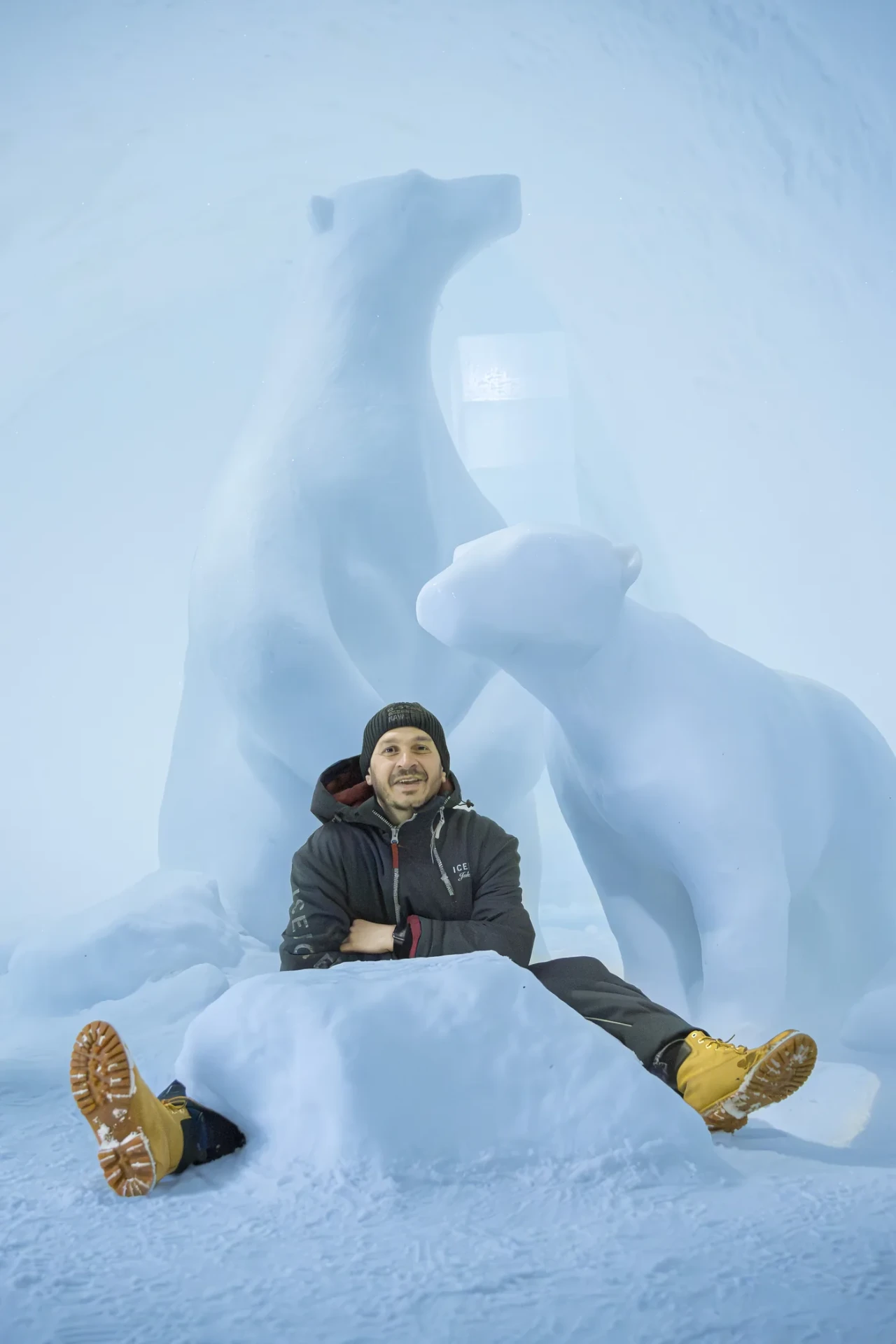 Guest admiring a hand-carved ice sculpture in an art suite
