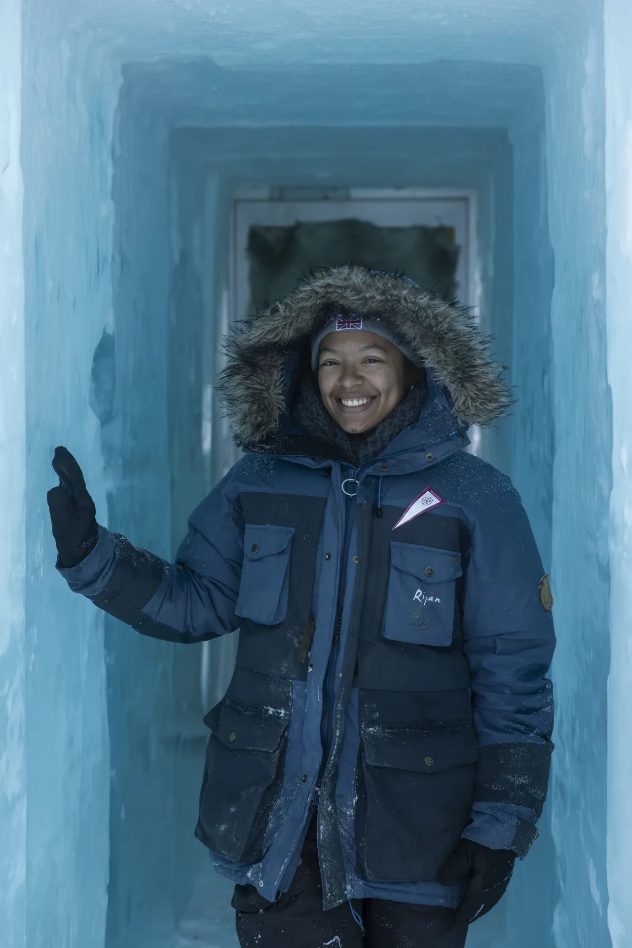 Guest walking through an ice corridor inside the ICEHOTEL