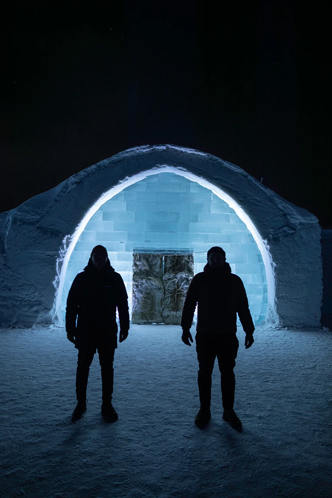 The ICEHOTEL entrance lit up at night