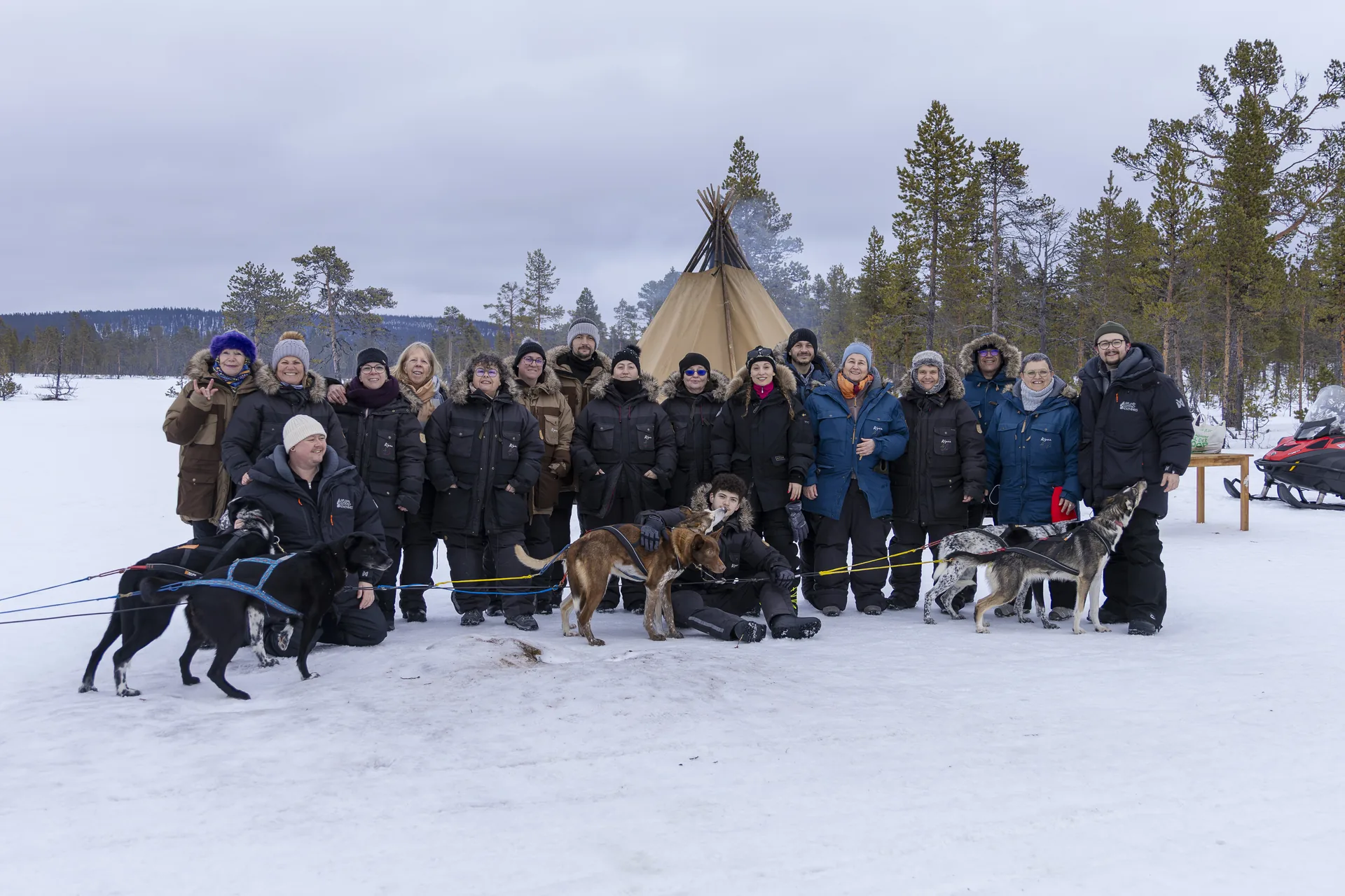 Guest group with their husky teams before the trail