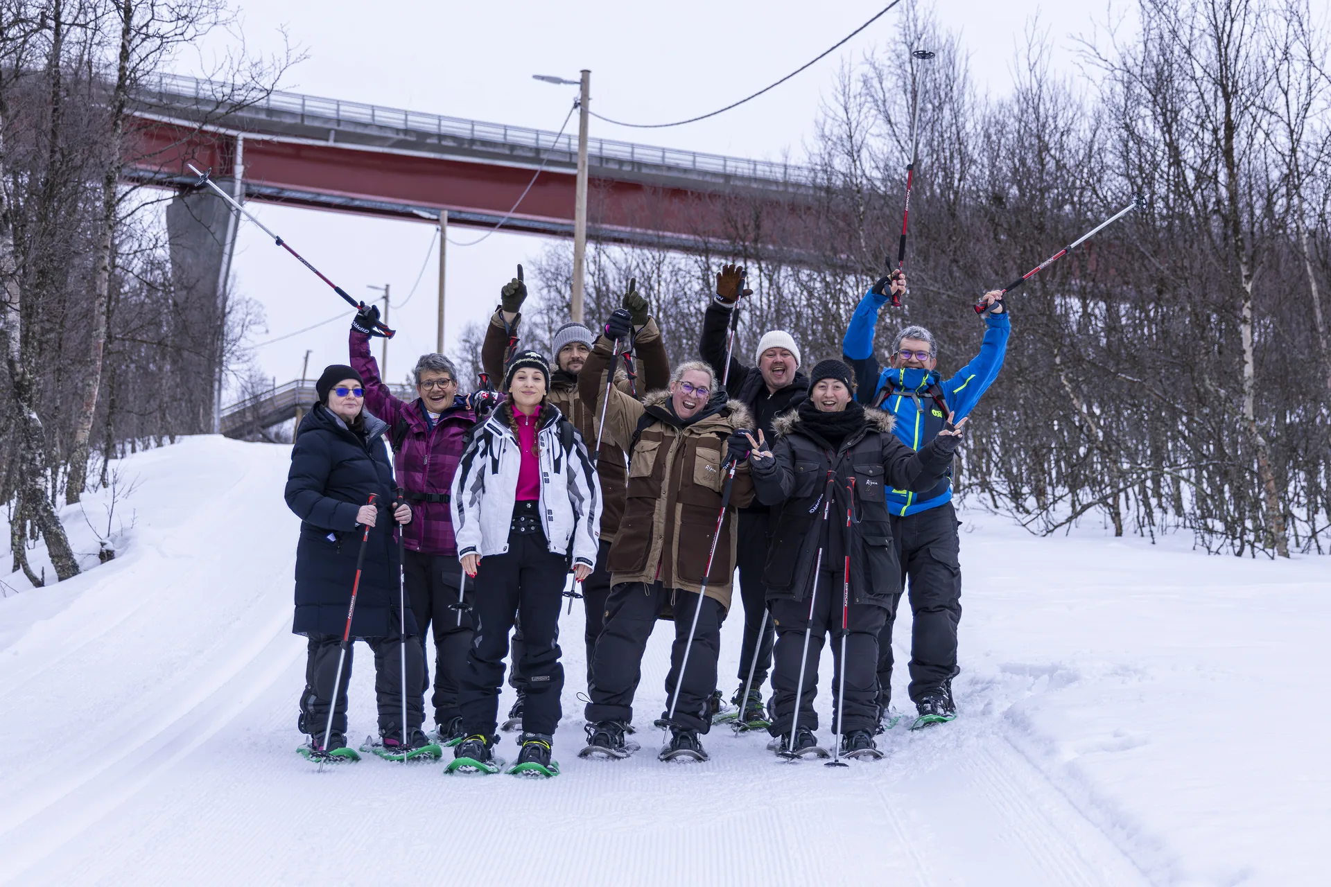 Small guest group on a snowy trail with their local host